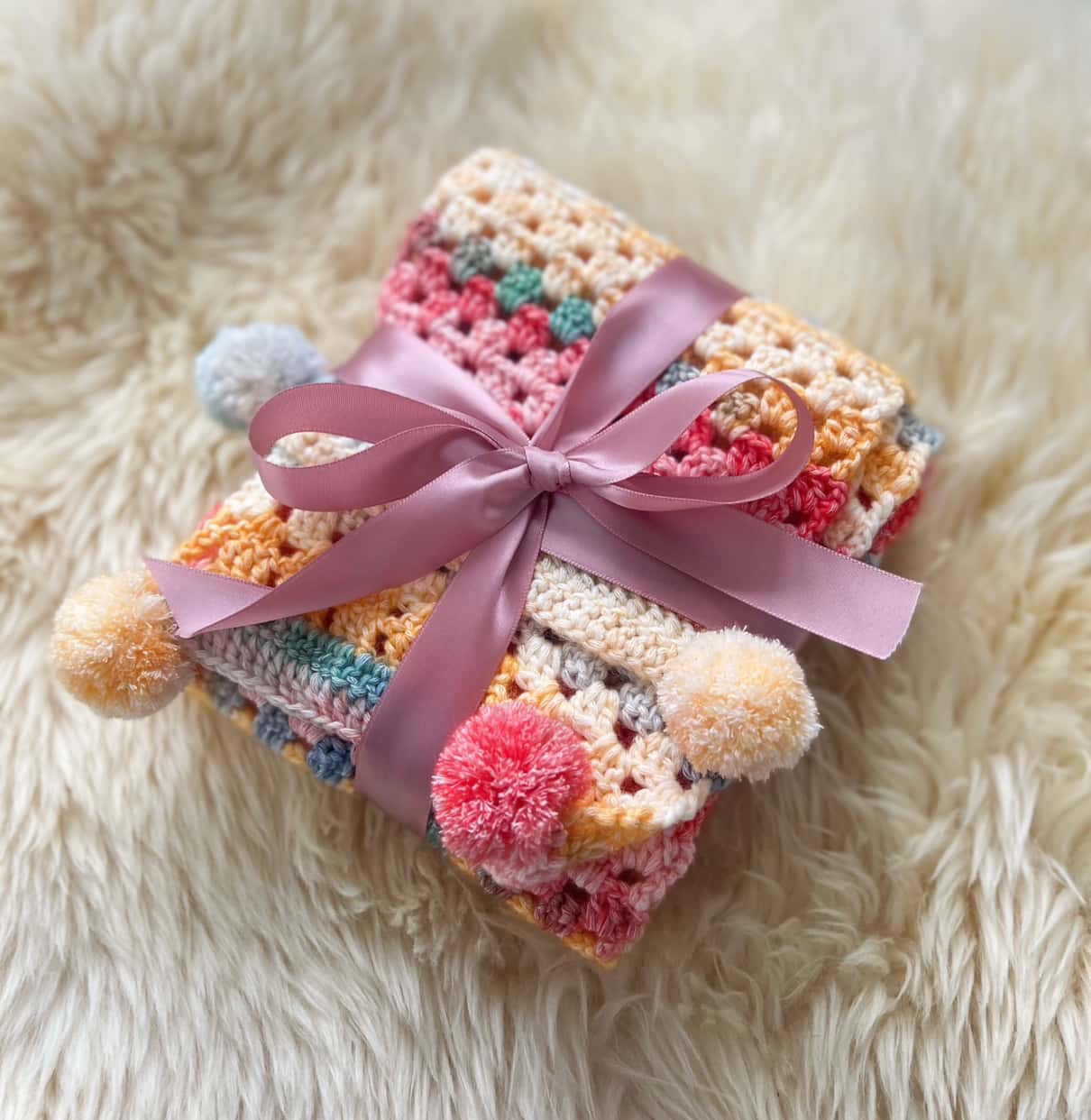 Cozy Pastel Crochet Scarf with Pom-Poms