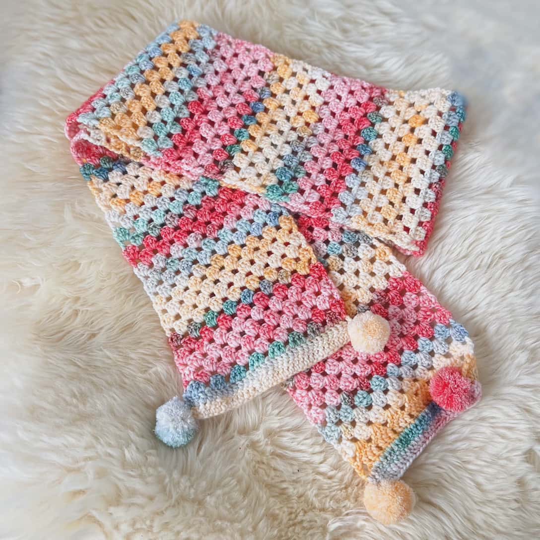 Cozy Pastel Crochet Scarf with Pom-Poms