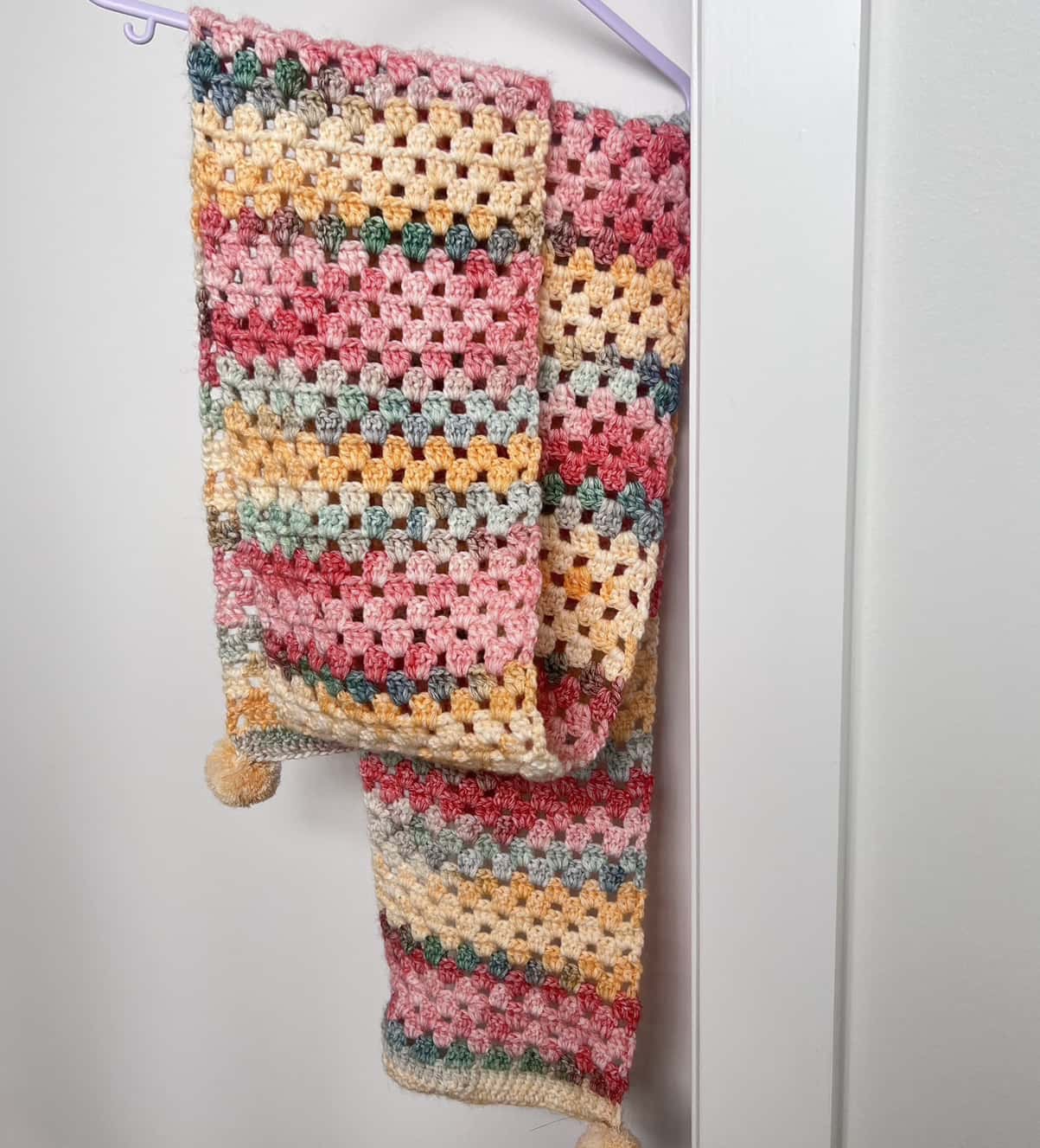 Cozy Pastel Crochet Scarf with Pom-Poms